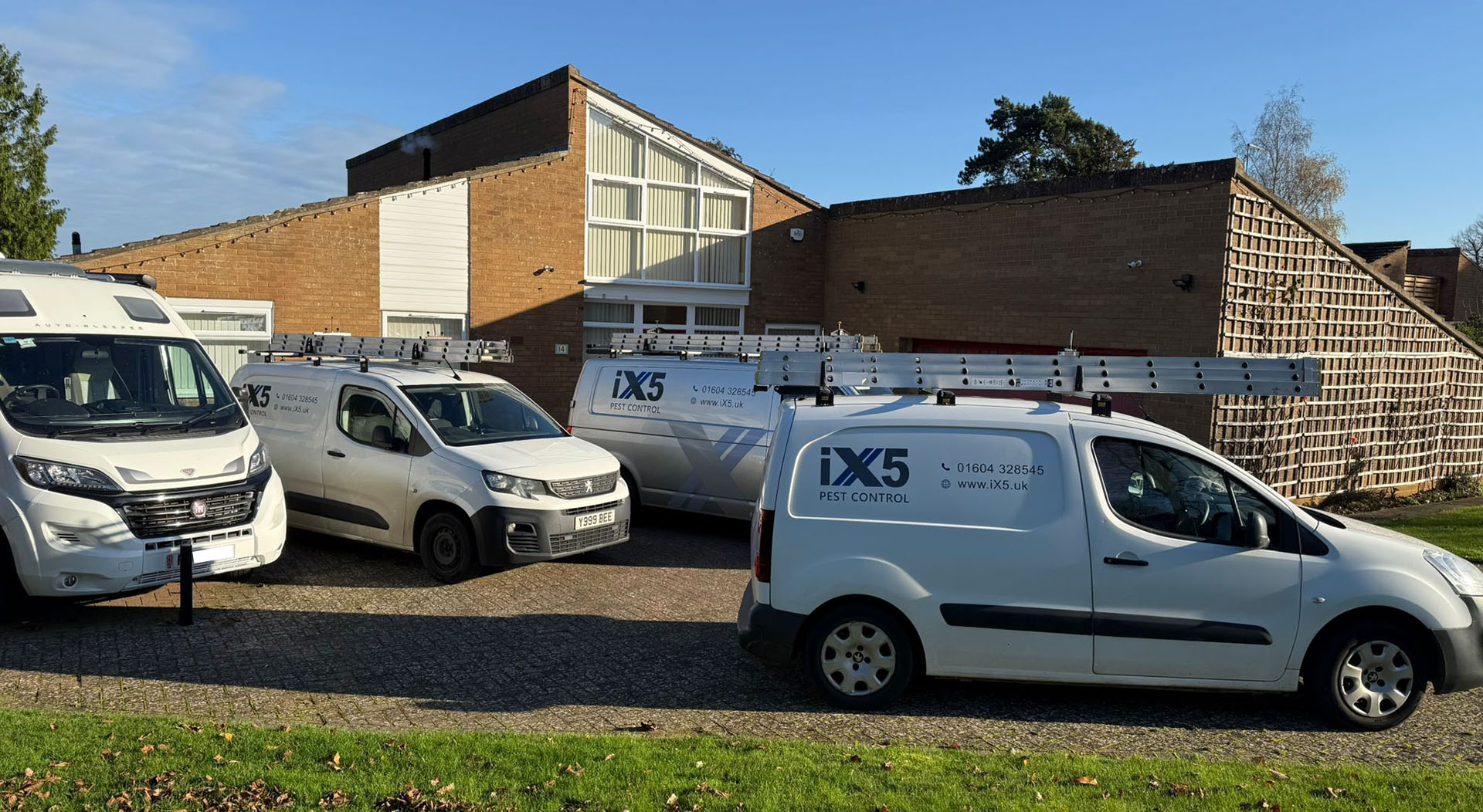 contact iX5 Pest Control this image shows three of our vans on site dealign with a pest problem