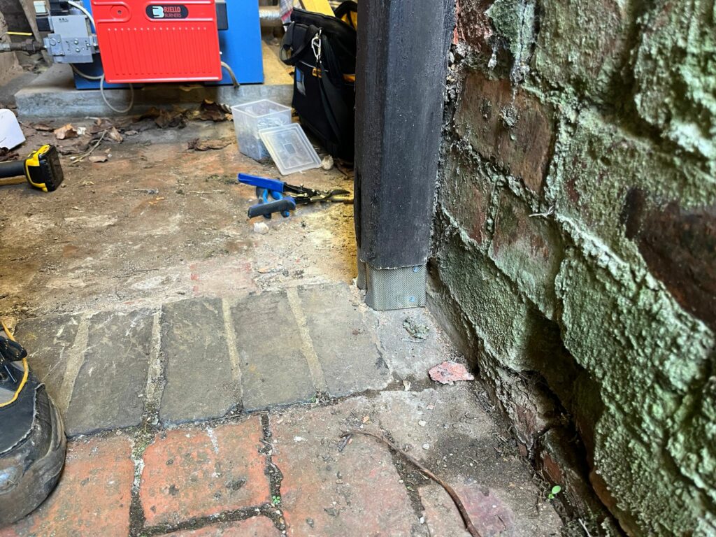 at proofing repair with heavy-duty rodent-proof mesh installed to seal the boiler room access point