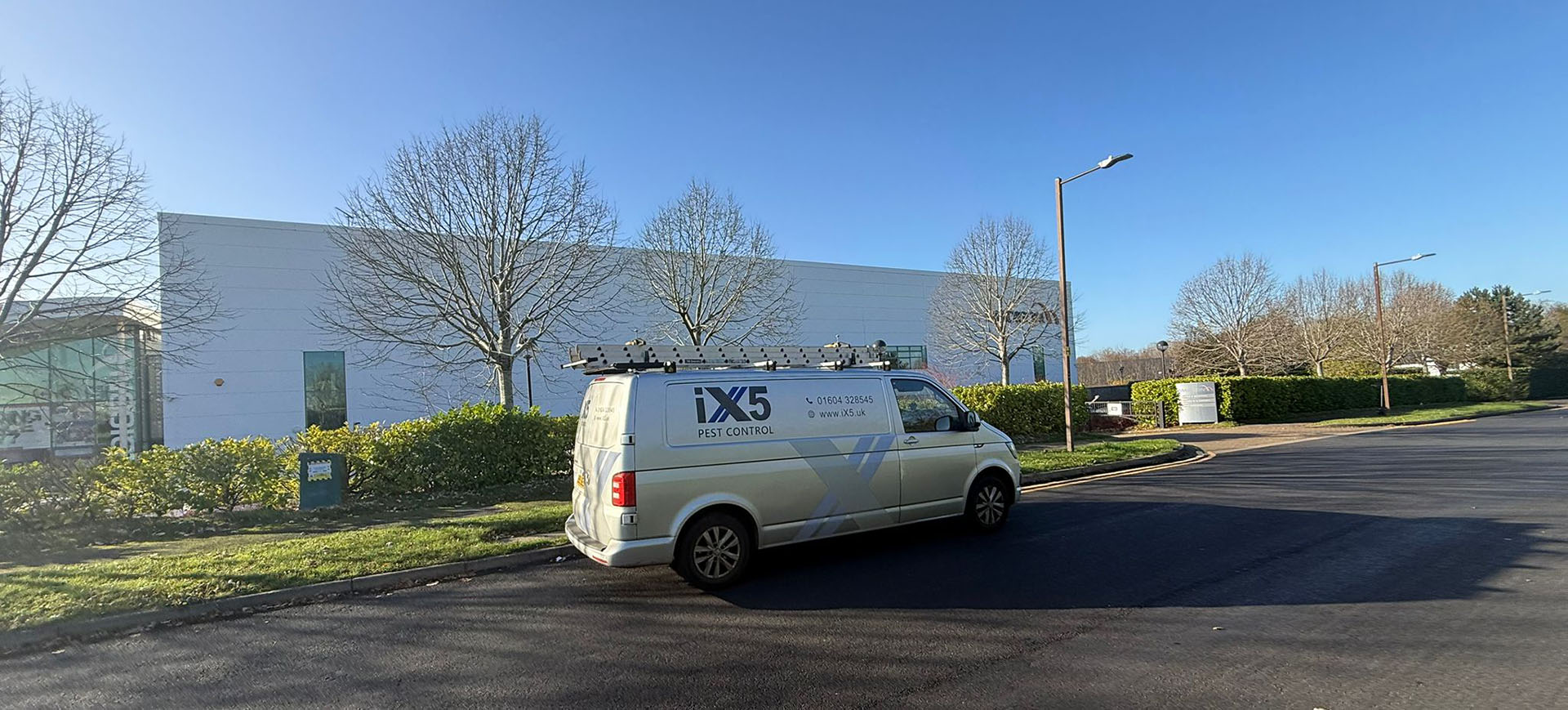 iX5 Pest Control van outside a commercial premises during a pest management visit